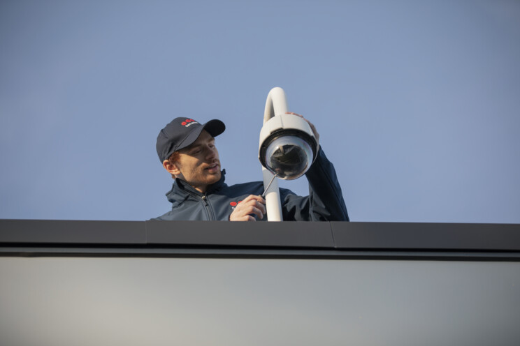 Securitas employee installing camera